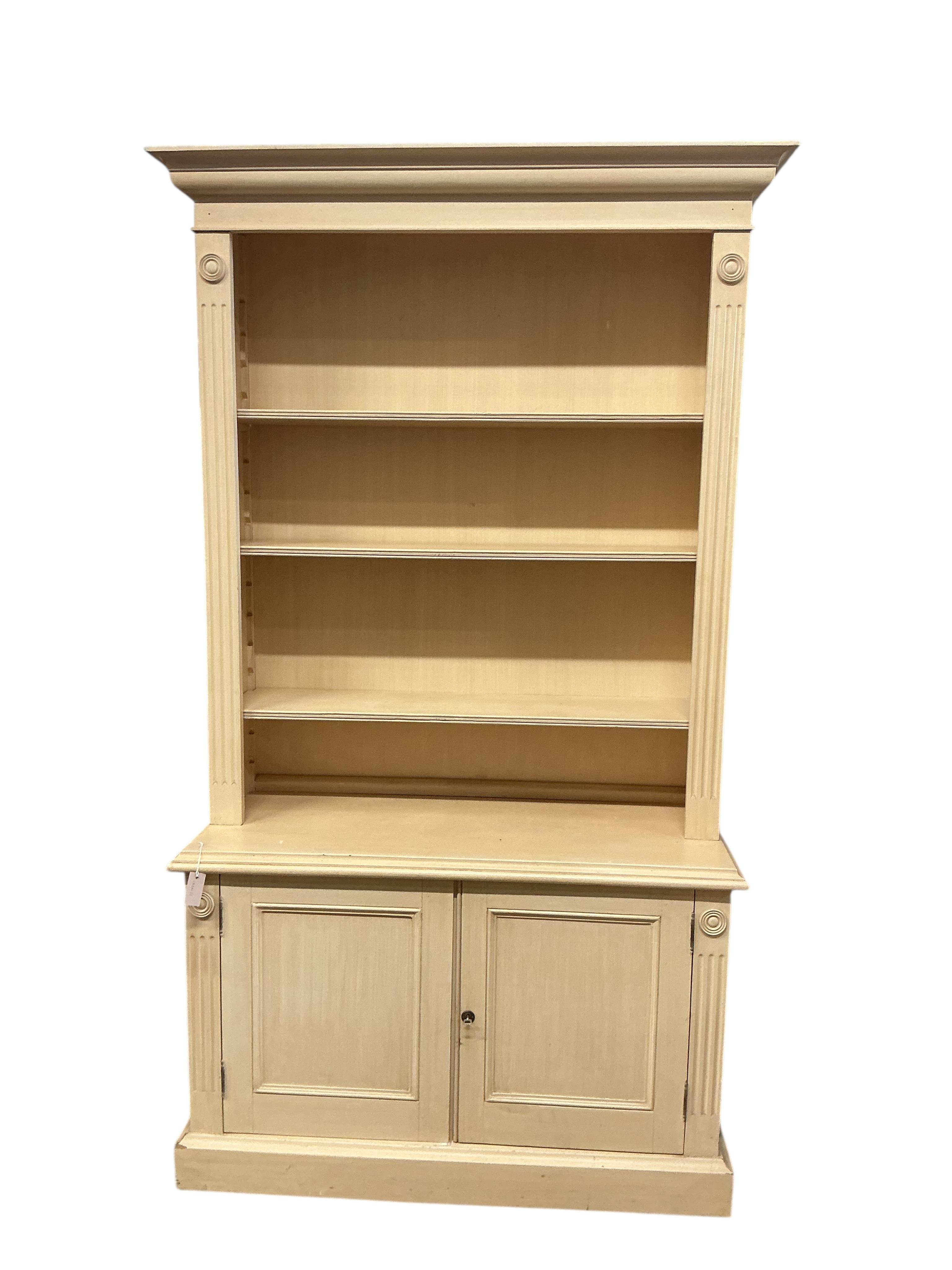 A Georgian style painted library bookcase, width 126cm, depth 50cm, height 230cm